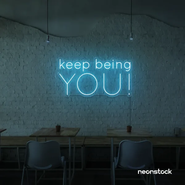 Keep Being You neon sign in ice blue for empowerment decor, teen rooms, and creative wall spaces.