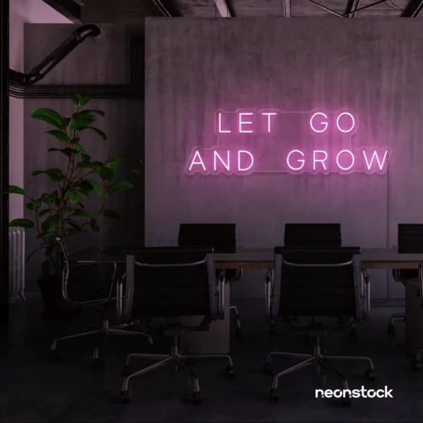 Let Go and Grow neon sign in baby pink for growth mindset decor, wellness rooms, and modern inspiration walls.