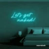 Let's Get Naked neon sign in mint green for bathroom decor, cheeky bedrooms, and romantic lighting.