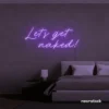 Let's Get Naked neon sign in purple for bathroom decor, cheeky bedrooms, and romantic lighting.