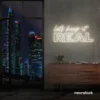 Let's Keep It Real neon sign in neutral white for urban decor, creative rooms, and stylish hangouts.