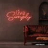 Live Simply neon sign in peachy pink for minimalist decor, peaceful homes, and calming interiors.