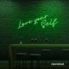 Love Yourself neon sign in deep green for self-love decor, beauty rooms, and empowering spaces.