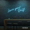 Love Yourself neon sign in ice blue for self-love decor, beauty rooms, and empowering spaces.