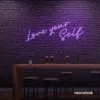 Love Yourself neon sign in purple for self-love decor, beauty rooms, and empowering spaces.