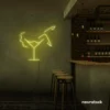 Martini girl neon sign in lemon yellow for bright and cheerful decor.