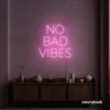 No Bad Vibes neon sign in baby pink for dorm walls, man caves, and modern mood-boosting decor.
