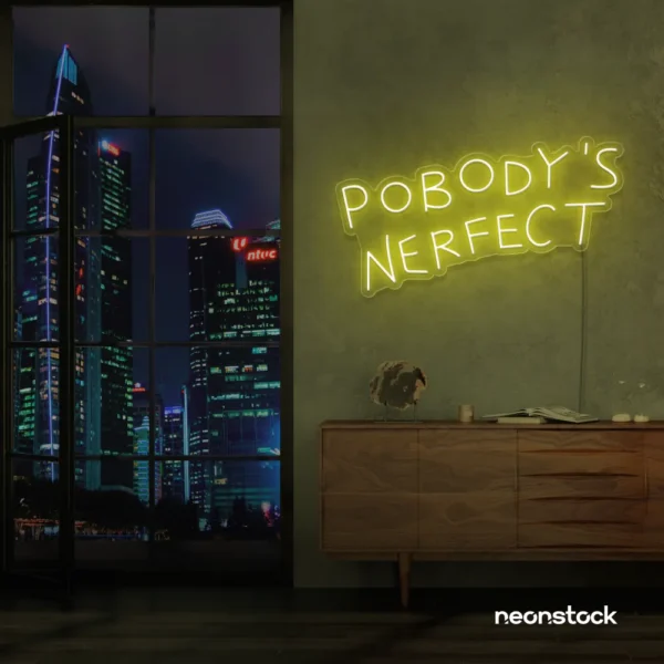 Nobody's Perfect neon sign in lemon yellow for humorous decor, vanity setups, and real-life vibes.