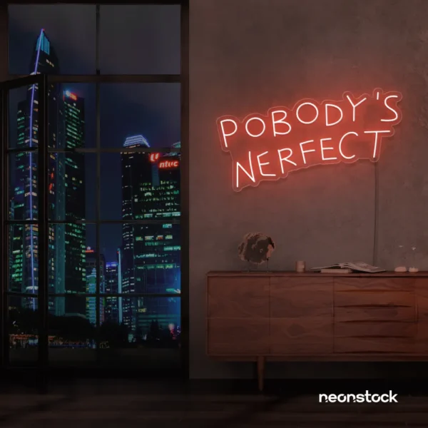 Nobody's Perfect neon sign in peachy pink for humorous decor, vanity setups, and real-life vibes.