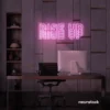 Rise Up neon sign in baby pink for gyms, empowerment decor, and motivational spaces.