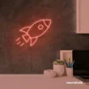 Rocket neon sign in peachy pink for kids' rooms, play areas, and space-themed nursery decor.