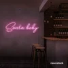 Santa Baby neon sign in baby pink for holiday parties, Christmas decor, and festive photo backdrops.