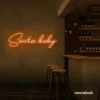 Santa Baby neon sign in orange for holiday parties, Christmas decor, and festive photo backdrops.