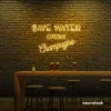 Save Water Drink Champagne neon sign in golden yellow for party kitchens, wine bars, and bubbly wall decor.