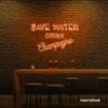 Save Water Drink Champagne neon sign in orange for party kitchens, wine bars, and bubbly wall decor.