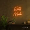 Self Made neon sign in orange for home offices, studios, and entrepreneur decor.
