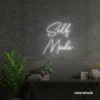 Self Made neon sign in white for home offices, studios, and entrepreneur decor.