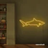 Shark neon sign in golden yellow for kids' rooms, ocean-themed decor, and fun playroom walls.