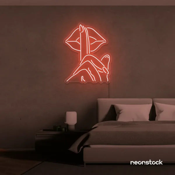 Shushing lips neon sign in peachy pink for beauty salons, glam rooms, and bold home decor.