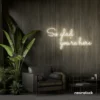 So Glad You Are Here neon sign in neutral white for entryways, restaurant walls, and welcoming interiors.