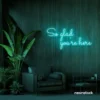 So Glad You Are Here neon sign in mint green for entryways, restaurant walls, and welcoming interiors.