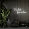 So Glad You Are Here neon sign in white for entryways, restaurant walls, and welcoming interiors.