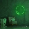 Deep green neon wall sign featuring a circular design with two stars, glowing vibrantly in a cozy room setup.