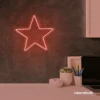 Star neon sign in peachy pink for kids' rooms, nursery walls, and bedtime light decor.