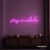 Stay Awhile neon sign in pink for cozy cafes, home decor, and hospitality settings.