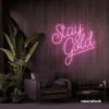 Stay Gold neon sign in baby pink for glam rooms, babe caves, and feminine decor.