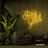 Stay Gold neon sign in golden yellow for glam rooms, babe caves, and feminine decor.