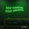 Stop Thinking Start Drinking neon sign in deep green for bar walls, man caves, and party spaces.