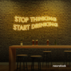 Stop Thinking Start Drinking neon sign in golden yellow for bar walls, man caves, and party spaces.