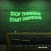 Stop Thinking Start Drinking neon sign in green for bar walls, man caves, and party spaces.