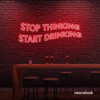 Stop Thinking Start Drinking neon sign in red for bar walls, man caves, and party spaces.