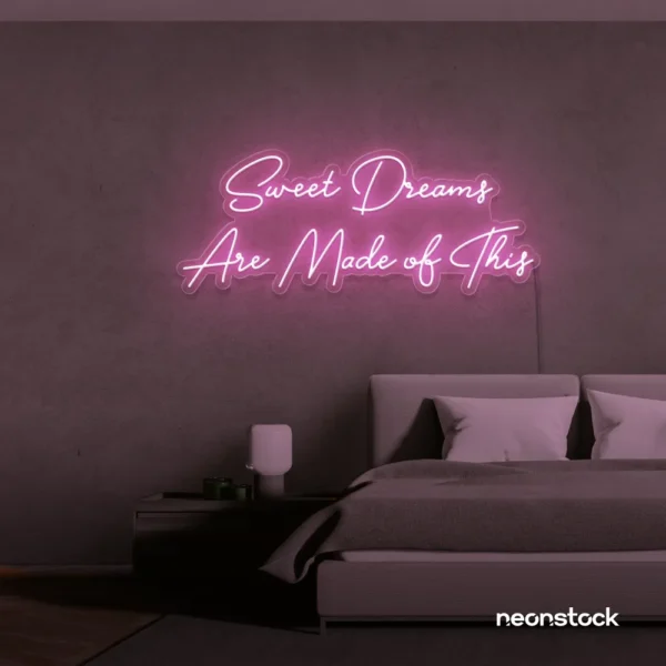 Sweet Dreams Are Made of This neon sign in baby pink for bedrooms, dreamy wall decor, and ambient lighting.