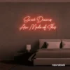 Sweet Dreams Are Made of This neon sign in peachy pink for bedrooms, dreamy wall decor, and ambient lighting.