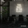 This Must Be The Place neon sign in neutral white for cozy salons, boutique shops, and cafe decor.