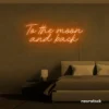 To the Moon and Back neon sign in orange for nursery rooms, kids' spaces, and bedtime wall decor.