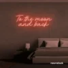 To the Moon and Back neon sign in peachy pink for nursery rooms, kids' spaces, and bedtime wall decor.