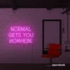Normal Gets You Nowhere neon sign in pink for bold interiors, creative offices, and motivational decor.