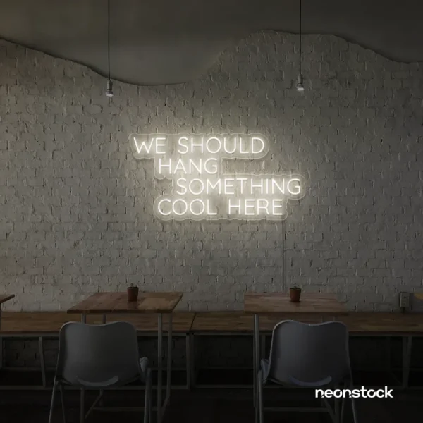 Neon sign text 'We should hang something cool here' in Neutral white for wall art and home decor