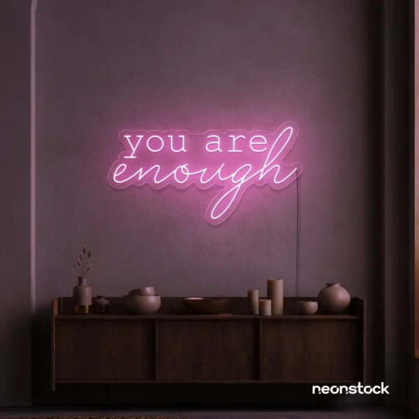 You Are Enough neon sign in baby pink for self-love decor, therapy rooms, and calm spaces.