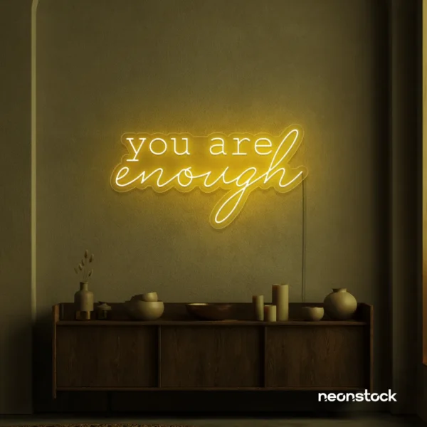 You Are Enough neon sign in golden yellow for self-love decor, therapy rooms, and calm spaces.