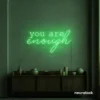 You Are Enough neon sign in green for self-love decor, therapy rooms, and calm spaces.