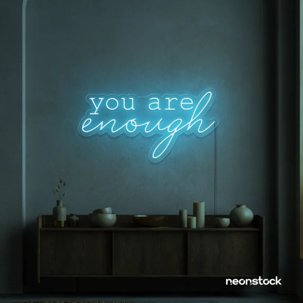 You Are Enough neon sign in ice blue for self-love decor, therapy rooms, and calm spaces.
