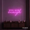 You Are Enough neon sign in pink for self-love decor, therapy rooms, and calm spaces.
