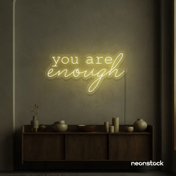 You Are Enough neon sign in warm white for self-love decor, therapy rooms, and calm spaces.
